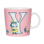 A pink ceramic mug with the letter Y and a cartoon illustration of a character from the Moomin series.